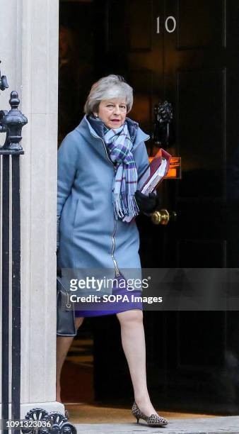Prime Minister Theresa May is seen departing from Number 10 Downing Street to attend Prime Minister's Questions in the House of Commons.