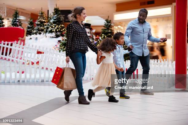 shopping christmas with family and santa claus at shopping mall - heritage shopping centre stock pictures, royalty-free photos & images