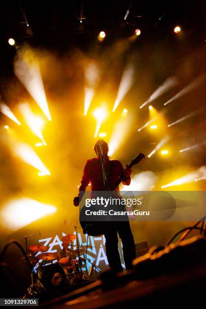 rock musician singing on stage - guitarist band stock pictures, royalty-free photos & images