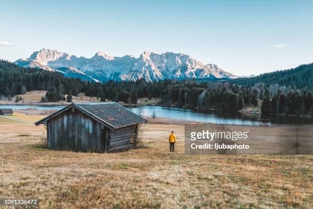 enjoying some rest and relaxation - wooden hut stock pictures, royalty-free photos & images