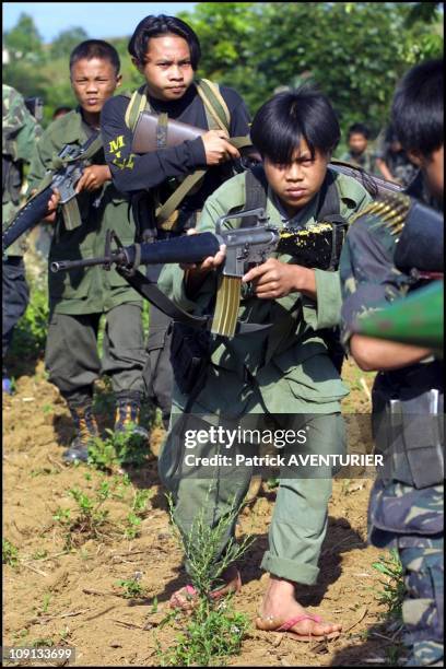 Exclusif. Moro Islamic Liberation Front On January 3Rd, 2002 In Marawi, Philippines. Meeting Of Fighters Of 501St Brigade Of Milf In Pantaragat Near...