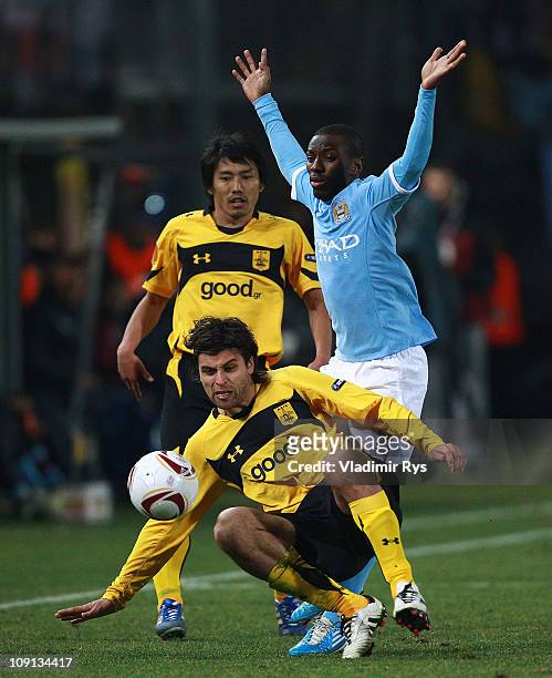 Juan Carlos Toja of Aris and Shaun Wright-Phillips of Machester City in action during the first leg, round of 32 UEFA Europa League match between...