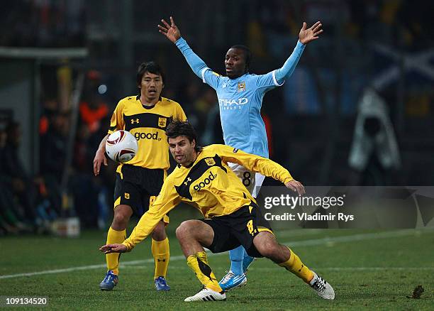 Juan Carlos Toja of Aris and Shaun Wright-Phillips of Manchester City in action during the first leg, round of 32 UEFA Europa League match between...
