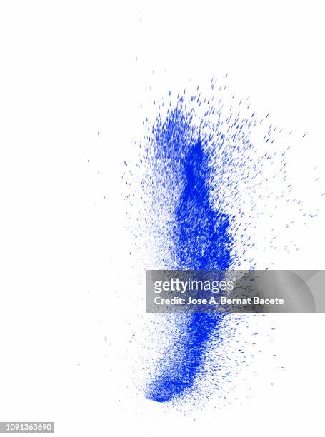explosion by an impact of a cloud of particles of powder of color blue on a white background. - powder blue imagens e fotografias de stock
