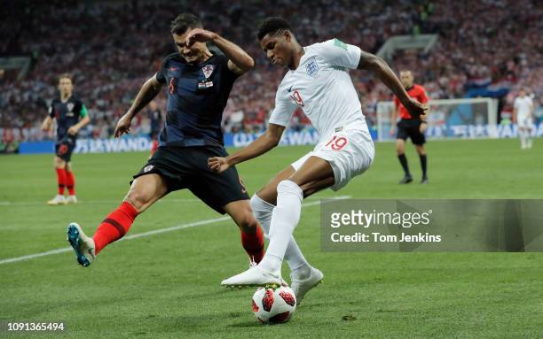 Marcus Rashford of England tries to get past Dejan Lovren of Croatia during the England v Croatia FIFA World Cup 2018 semi-final at the Luzhniki...