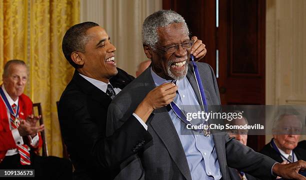 President Barack Obama presents Basetball Hall of Fame member and human rights advocate Bill Russell the 2010 Medal of Freedom in the East Room of...