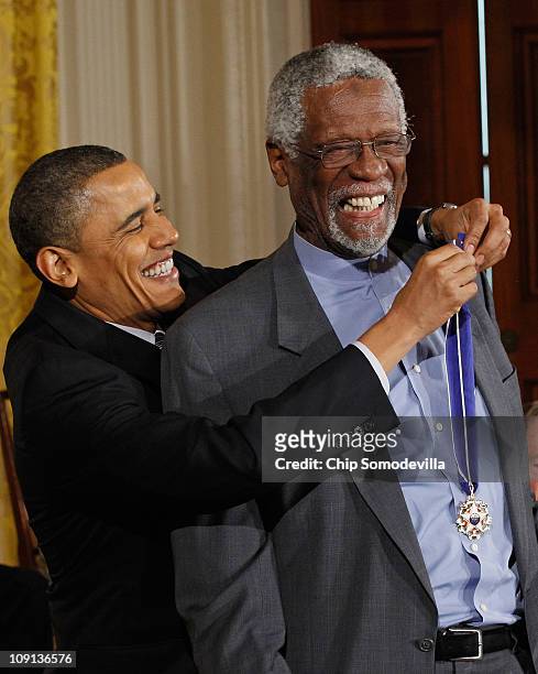President Barack Obama presents Basetball Hall of Fame member and human rights advocate Bill Russell the 2010 Medal of Freedom in the East Room of...