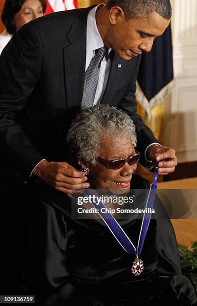 President Barack Obama presents poet and author Maya Angelou with the 2010 Medal of Freedom in the East Room of the White House February 15, 2011 in...