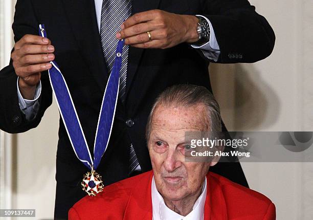 Baseball Hall of Fame member Stan Musial is presented with the 2010 Medal of Freedom by U.S. President Barack Obama during an East Room event at the...