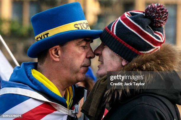 Anti-Brexit protester Steve Bray and a pro-Brexit protester argue as they demonstrate outside the Houses of Parliament in Westminster on January 08,...