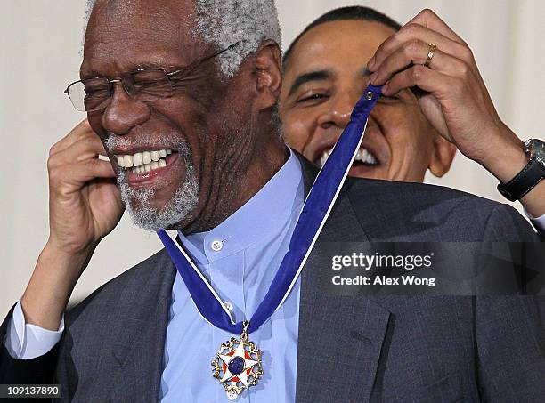 Former Boston Celtics captain Bill Russell is presented with the 2010 Medal of Freedom by U.S. President Barack Obama during an East Room event at...