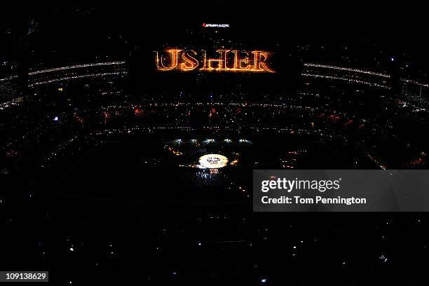 Usher and the Black Eyed Peas perform during the Bridgestone Super Bowl XLV Halftime Show at Cowboys Stadium on February 6, 2011 in Arlington, Texas.