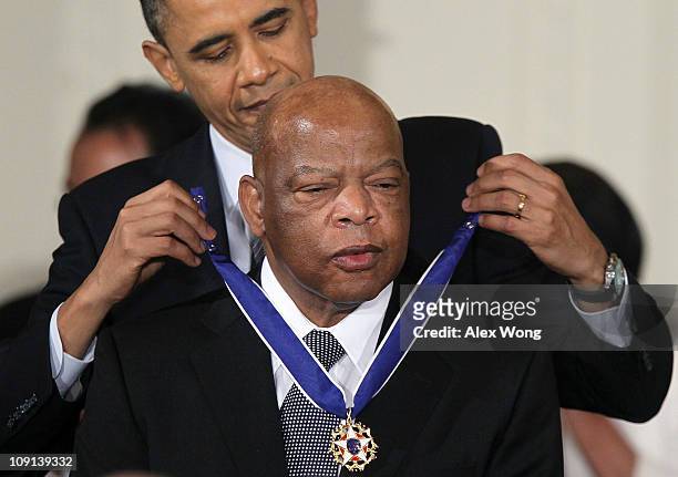 Rep. John Lewis is presented with the 2010 Medal of Freedom by President Barack Obama during an East Room event at the White House February 15, 2011...