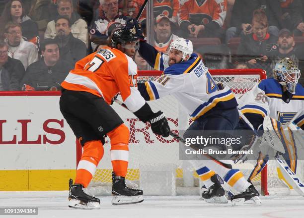 Robert Bortuzzo of the St. Louis Blues holds up Wayne Simmonds of the Philadelphia Flyers at the Wells Fargo Center on January 07, 2019 in...