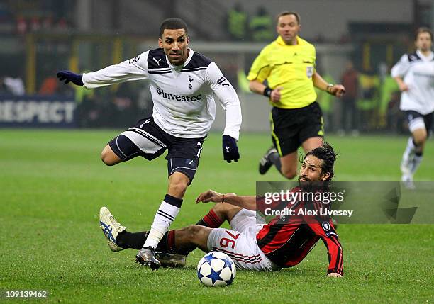 Aaron Lennon of Tottenham Hotspur beats Mario Yepes of AC Milan to set up the winning goal during the UEFA Champions League round of 16 first leg...