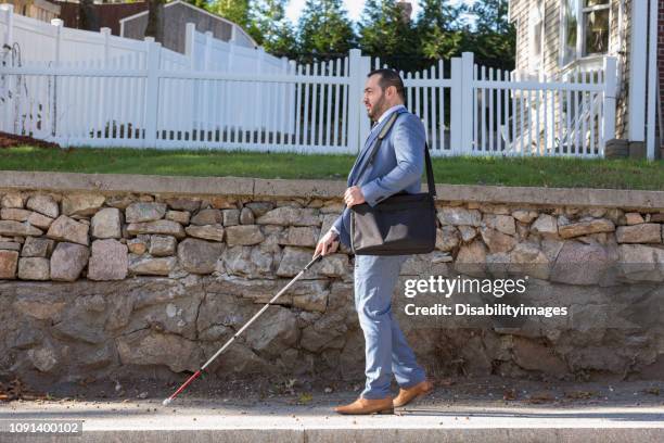 businessman with visual impairment outside with his cane - 白杖 ストックフォトと画像