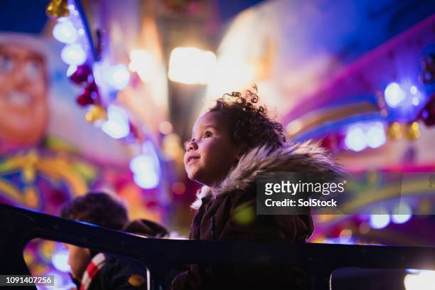 first time at the funfair - christmas children stock pictures, royalty-free photos & images