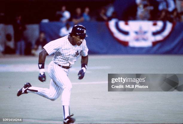 Rickey Henderson of the New York Yankees runs to first base during the 56th Major League Baseball All-Star Game at the Hubert H. Humphrey Metrodome...