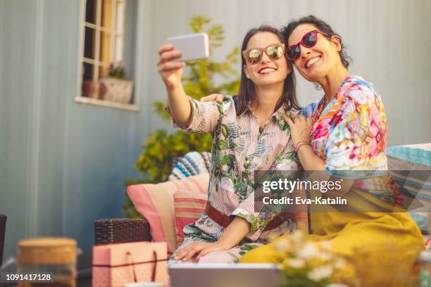 mother and daughter are taking selfies - mothers day gift daughter stock pictures, royalty-free photos & images