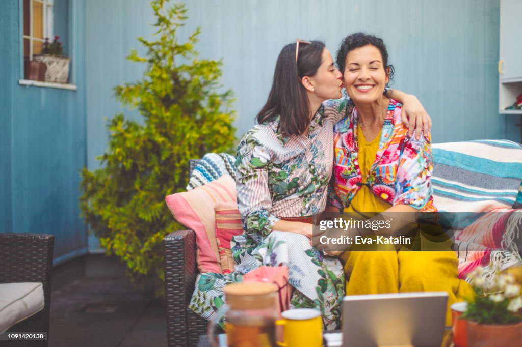 Mother and daughter are embracing each other
