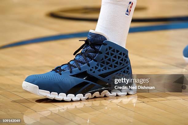 The shoe of John Wall of the Washington Wizards as he stands on the court against the San Antonio Spurs during a NBA game at the Verizon Center on...