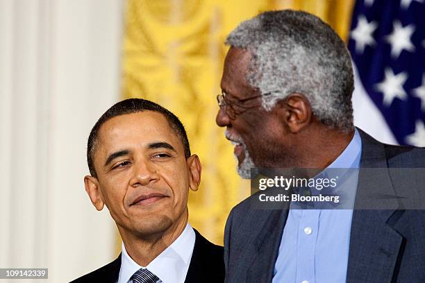 Bill Russell, former professional basketball player and head coach of the Boston Celtics, right, is awarded the Presidential Medal of Freedom from...