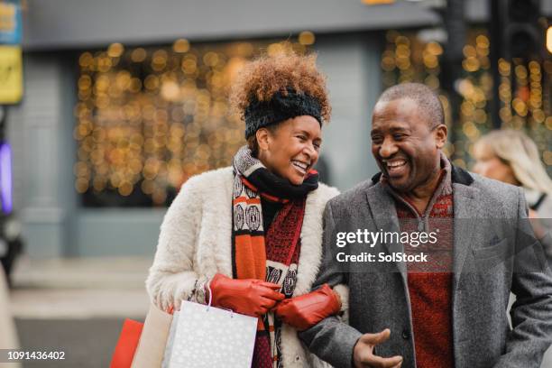 quality time together at christmas - black couple walking date stock pictures, royalty-free photos & images