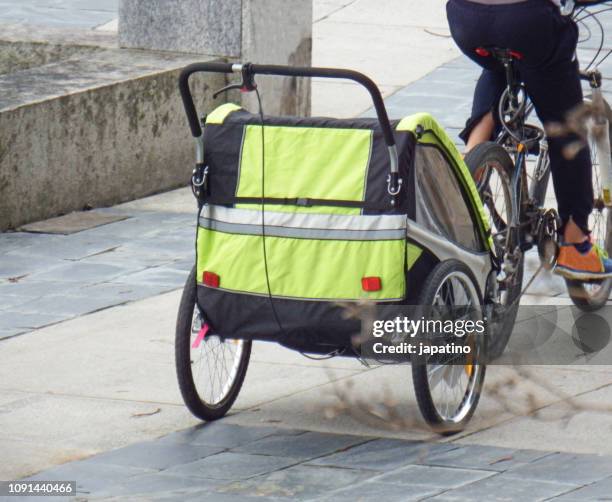 bicycle trailer to carry small children - trailer stock-fotos und bilder