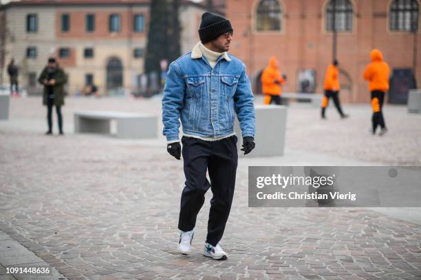 Guest is seen wearing shearling denim jacket during the 95th Pitti Uomo at Fortezza Da Basso on January 08, 2019 in Florence, Italy.