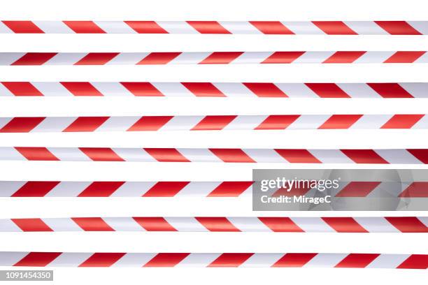 red and white striped cordon tape - fita delimitadora imagens e fotografias de stock