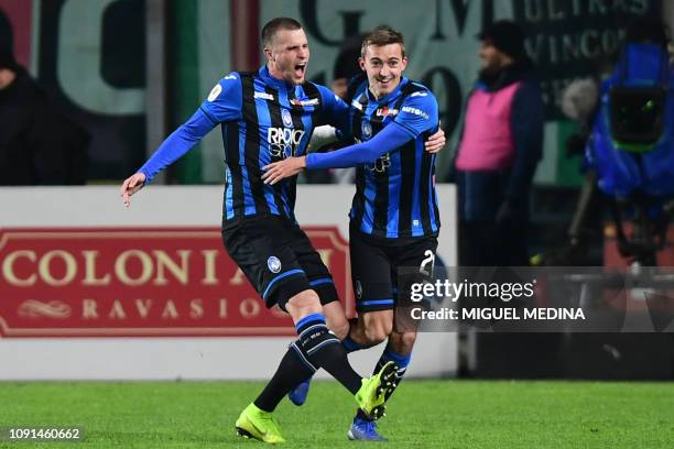 Atalanta's Belgian defender Timothy Castagne celebrates with Atalanta's Dutch defender Hans Hateboer after opening the scoring during the Italian Tim...