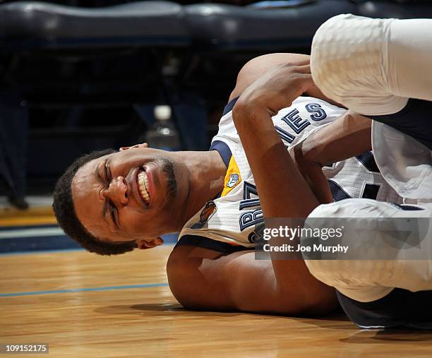 Rudy Gay of the Memphis Grizzlies lays on the floor with a shoulder injury during a game against the Philadelphia 76ers on February 15, 2011 at...