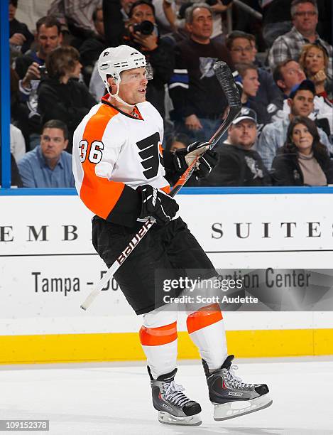 Darroll Powe of the Philadelphia Flyers smiles as he skates back to the bench after scoring a penalty shot against the Tampa Bay Lightning at the St....