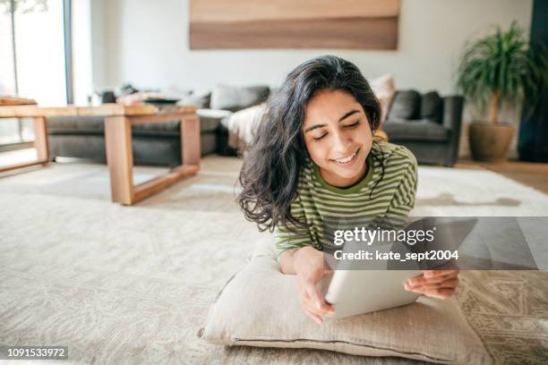 smiling millennial with tablet - 18-25 2004 stock pictures, royalty-free photos & images