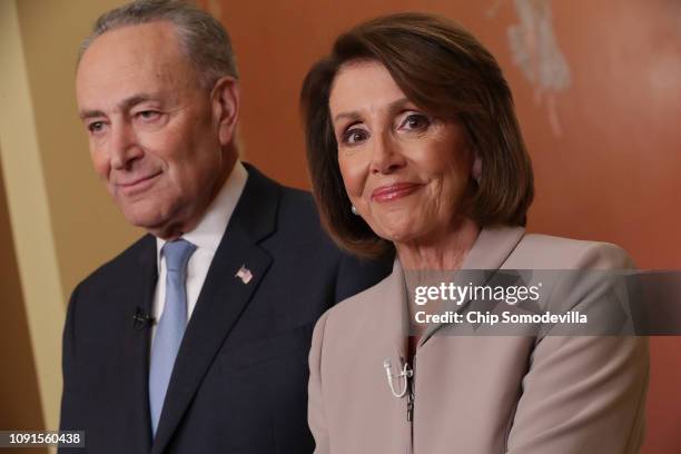 Speaker of the House Nancy Pelosi and Senate Minority Leader Charles Schumer pose for photographs after delivering a televised response to President...