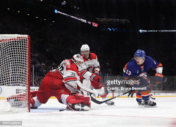 Curtis McElhinney of the Carolina Hurricanes makes the third period save on Mathew Barzal of the New York Islanders at NYCB Live at the Nassau...