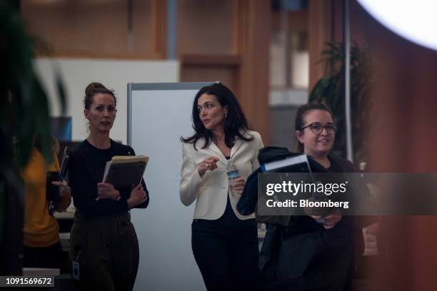 Sheryl Sandberg, chief operating officer of Facebook Inc., walks to a Bloomberg Television interview at the company's headquarters in Menlo Park,...