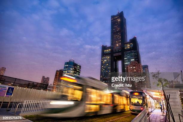 view of light rail tram and the skyline in kaohsiung - 高雄 ストックフォトと画像