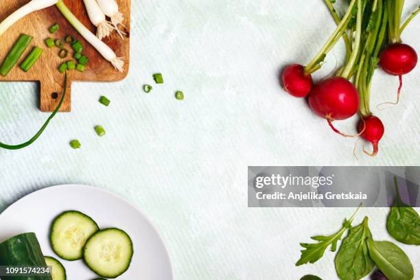 spring vegetables on light background with copy space. - pratos vegetarianos imagens e fotografias de stock