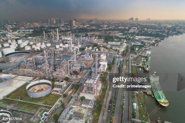 aerial view of oil refinery and gas industry in petrochemical plant at twilight - saudi arabia industry stock pictures, royalty-free photos & images