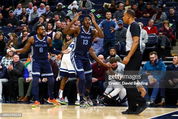 Jaren Jackson Jr. #13 and Shelvin Mack of the Memphis Grizzlies react after Jackson Jr. Is called for a foul against the Minnesota Timberwolves in...