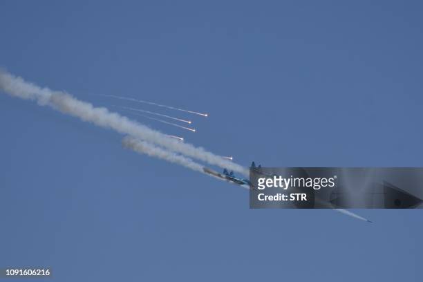 Two Myanmar military jet fighters fire missiles during combined exercise by Myanmar army and air force near Magway on January 31, 2019. / The...