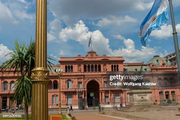 Plaza de Mayo in Buenos Aires, Argentina with bronze equestrian statue of General Manuel Belgrano and Casa Rosada in the background.