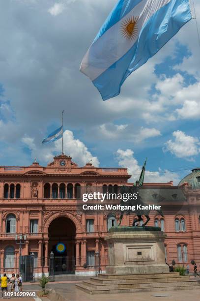 Plaza de Mayo in Buenos Aires, Argentina with bronze equestrian statue of General Manuel Belgrano and Casa Rosada in the background.