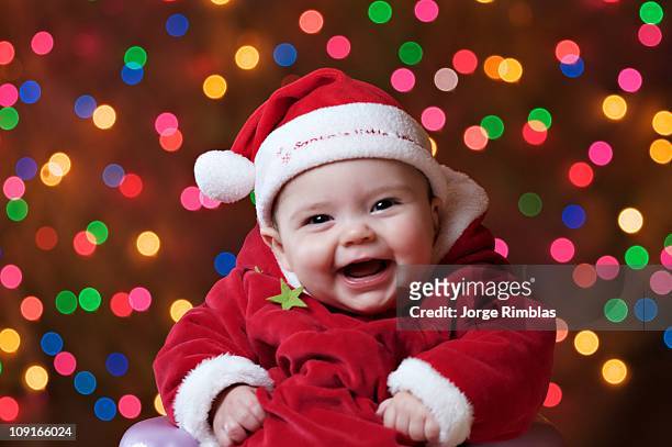 happy santa's little helper - baby christmas stock-fotos und bilder