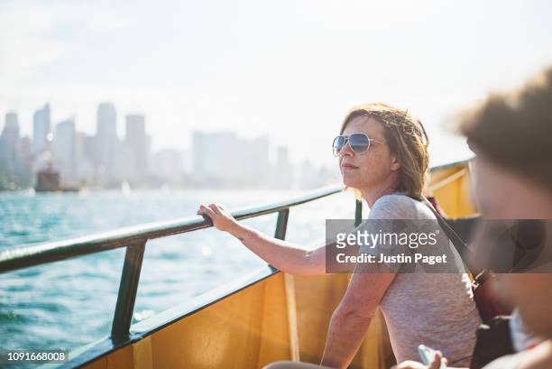 woman on ferry in sydney harbour - tourist sydney stockfoto's en -beelden