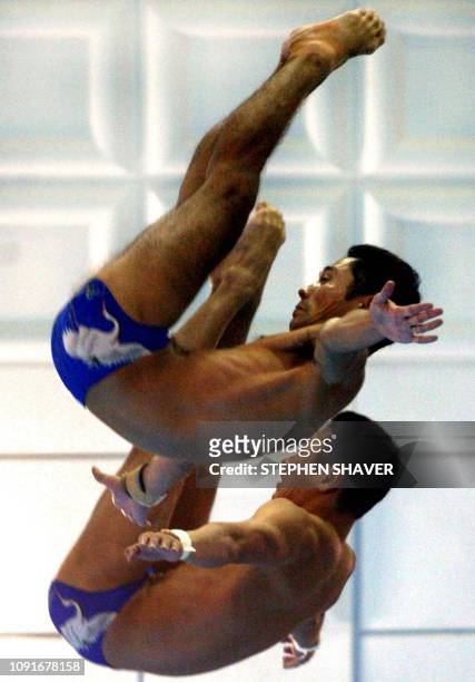 Japan's Miyamoto Kichiro and Miyamoto Kotaro perform in the men's 10m Synchronized Diving event 08 October 2002 at the 14th Asian Games in Busan....