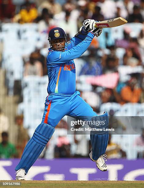 Virender Sehwag of India edges the ball away towards the bounary during the 2011 ICC World Cup Warm up game against India and New Zealand at the MA...