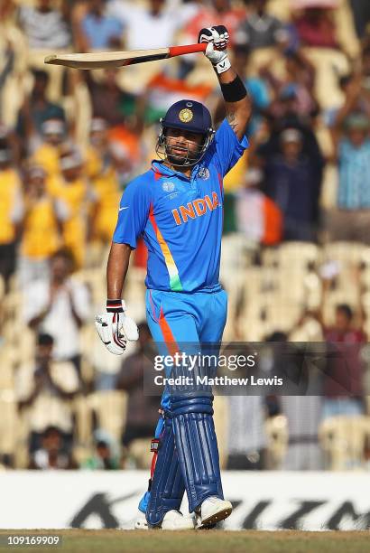 Virat Kohli of India celebrates his half century during the 2011 ICC World Cup Warm up game against India and New Zealand at the MA Chidambaram...