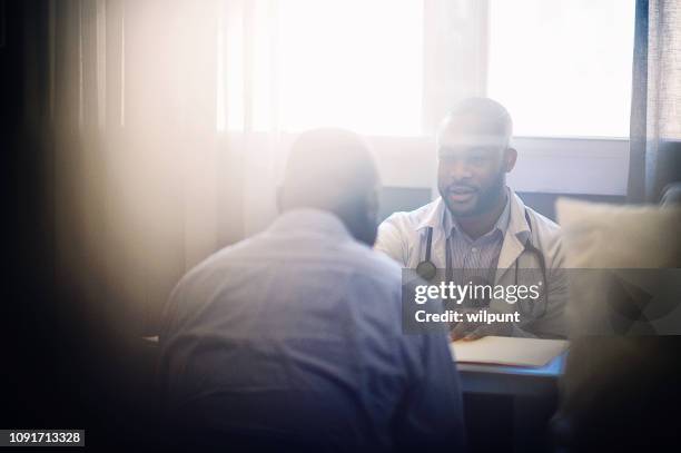 medical consultation view through window - back lit doctor stock pictures, royalty-free photos & images